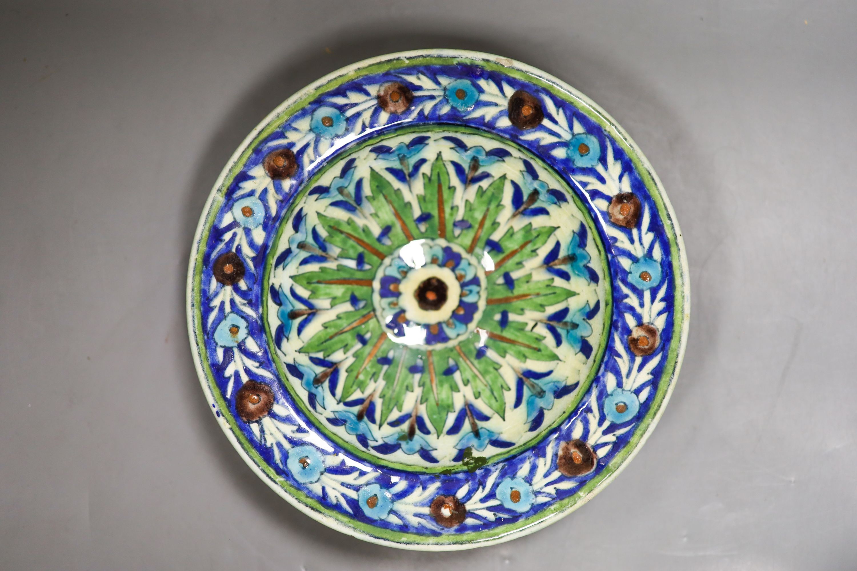 A Persian Iznik style pottery bowl and a Persian Qajar dynasty vase, 22.5cm